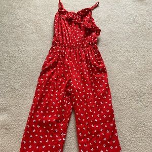 Red jumpsuit with white flowers